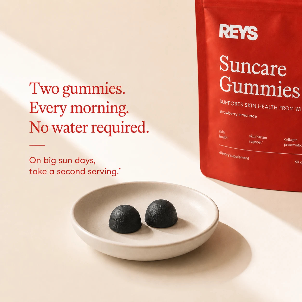Two gummies, every morning, no water required — two dark gummies on a ceramic dish beside the pouch; on big sun days take a second serving